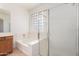 Bathroom with walk in shower and soaking tub at 8541 W Malapai Dr, Peoria, AZ 85345