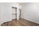 Light bedroom with wood flooring and a closet with sliding doors at 8541 W Malapai Dr, Peoria, AZ 85345