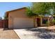 View of home highlighting the two-car garage, desert landscaping, and well-kept exterior at 8541 W Malapai Dr, Peoria, AZ 85345