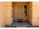 Covered front porch featuring a traditional door, stylish pillars, and decorative window at 8541 W Malapai Dr, Peoria, AZ 85345