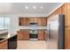 Updated kitchen with stainless steel appliances and granite countertops at 8541 W Malapai Dr, Peoria, AZ 85345