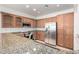 Bright kitchen featuring granite countertops and stainless steel appliances at 8541 W Malapai Dr, Peoria, AZ 85345