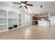 Spacious living room with tile floors and built-in shelving unit at 8541 W Malapai Dr, Peoria, AZ 85345