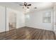 Spacious main bedroom with wood floors and adjacent bathroom at 8541 W Malapai Dr, Peoria, AZ 85345