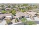 Stunning aerial view of a home with desert landscaping, a private gate and a three car garage at 9225 W Bajada Rd, Peoria, AZ 85383