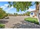 Expansive backyard featuring low maintenance desert landscaping and lush artificial turf at 9225 W Bajada Rd, Peoria, AZ 85383