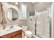Bathroom features a vanity, mirror, toilet and enclosed glass shower at 9225 W Bajada Rd, Peoria, AZ 85383