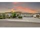 Stunning single-story home featuring lush desert landscaping and a circular driveway at 9225 W Bajada Rd, Peoria, AZ 85383