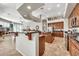 Spacious open kitchen with dark countertops, stainless steel appliances, an island, and abundant storage at 9225 W Bajada Rd, Peoria, AZ 85383