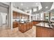 Spacious kitchen boasting abundant cabinets, granite countertops, pendant lighting, and barstool seating at 9225 W Bajada Rd, Peoria, AZ 85383