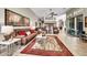 Expansive living room featuring a large rug, ceiling fan, with views of the kitchen and dining areas at 9225 W Bajada Rd, Peoria, AZ 85383