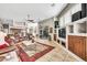 Spacious living room with a ceiling fan, comfortable furnishings, and an entertainment center for relaxing at 9225 W Bajada Rd, Peoria, AZ 85383