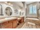 Main bathroom with dual sinks, bathtub and natural lighting at 9225 W Bajada Rd, Peoria, AZ 85383