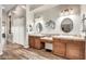 Main bathroom boasts dual sinks, wooden cabinetry and tile flooring at 9225 W Bajada Rd, Peoria, AZ 85383