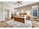 Spacious main bedroom with wood flooring, ceiling fan and neutral walls at 9225 W Bajada Rd, Peoria, AZ 85383