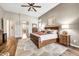 Bright main bedroom features wood flooring, large windows and neutral walls at 9225 W Bajada Rd, Peoria, AZ 85383