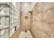 Close up of the shower with glass block wall and tiled walls at 9225 W Bajada Rd, Peoria, AZ 85383