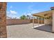 Gravel backyard with block wall for privacy and covered patio at 9601 S 44Th St, Phoenix, AZ 85044
