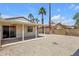 View of covered patio and backyard featuring desert landscaping with blue sky background at 9601 S 44Th St, Phoenix, AZ 85044