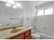 Clean bathroom with vanity, mirror, and shower over tub with white tiled walls at 9601 S 44Th St, Phoenix, AZ 85044