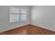 Simple bedroom with laminate floors and a window for natural light at 9601 S 44Th St, Phoenix, AZ 85044