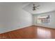 Bright and airy bedroom with laminate flooring, a ceiling fan, and window at 9601 S 44Th St, Phoenix, AZ 85044