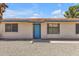 Front exterior of home featuring a brightly painted entry door and desert landscaping at 9601 S 44Th St, Phoenix, AZ 85044