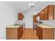 Spacious kitchen features laminate floors, light wood cabinets, ample counter space, and white appliances at 9601 S 44Th St, Phoenix, AZ 85044