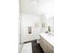 Bright bathroom featuring modern fixtures, a glass shower, and a stylish vanity at 1 E Lexington Ave # 1306, Phoenix, AZ 85012