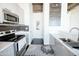 Modern kitchen with stainless appliances and stylish cabinets at 1 E Lexington Ave # 1306, Phoenix, AZ 85012