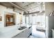 Open concept kitchen with modern appliances and access to living area at 1 E Lexington Ave # 1306, Phoenix, AZ 85012
