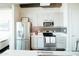 Updated kitchen featuring stainless steel appliances and stylish backsplash at 1 E Lexington Ave # 1306, Phoenix, AZ 85012