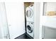 Modern laundry area featuring stacked washer and dryer units at 1 E Lexington Ave # 1306, Phoenix, AZ 85012