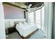 Bedroom featuring large windows with a city view and modern decor at 1 E Lexington Ave # 1306, Phoenix, AZ 85012
