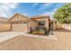 Charming single-story home with a well-maintained front yard and two-car garage at 10226 N 93Rd Dr, Peoria, AZ 85345