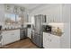 Bright kitchen features stainless appliances, granite countertops, and eat lettering at 10226 N 93Rd Dr, Peoria, AZ 85345