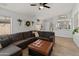 Spacious living area with a gray sectional and backyard views at 10226 N 93Rd Dr, Peoria, AZ 85345