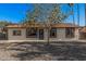 Welcoming single-story house with nice front yard, charming accents and gravel landscaping at 11025 E Cholla Rd, Mesa, AZ 85207