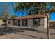 Beautiful single-story home with mature tree, gravel landscaping and painted brick accents at 11025 E Cholla Rd, Mesa, AZ 85207