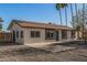 Inviting single-story home with a modern color scheme, gravel landscaping, and concrete driveway at 11025 E Cholla Rd, Mesa, AZ 85207