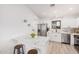 Modern kitchen features white cabinets, stainless steel appliances, and a marble island at 11025 E Cholla Rd, Mesa, AZ 85207