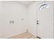 Convenient laundry area off the entry with utility connections and an exterior access door at 11025 E Cholla Rd, Mesa, AZ 85207