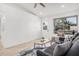 Bright living room features a large window, a door, and a comfortable seating area at 11025 E Cholla Rd, Mesa, AZ 85207