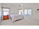 Spacious bedroom with multiple windows, neutral walls, and a ceiling fan at 11038 W Oraibi Dr, Peoria, AZ 85373