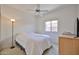Bedroom featuring neutral walls, a ceiling fan and natural light from the window at 11038 W Oraibi Dr, Peoria, AZ 85373