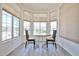 Sunny breakfast nook with large windows providing natural light, and seating for two at 11038 W Oraibi Dr, Peoria, AZ 85373