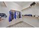 Spacious walk-in closet with ample hanging space and shelving for optimal storage at 11038 W Oraibi Dr, Peoria, AZ 85373