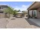 Backyard featuring gravel, brick pavers, and an outdoor gazebo at 1162 E Ranch Ct, Gilbert, AZ 85296