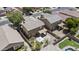 Aerial view of home's fenced backyard featuring covered patio, gravel area with fire pit and white party tent at 1162 E Ranch Ct, Gilbert, AZ 85296