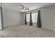 Primary bedroom with neutral walls, carpeting and ceiling fan at 1162 E Ranch Ct, Gilbert, AZ 85296